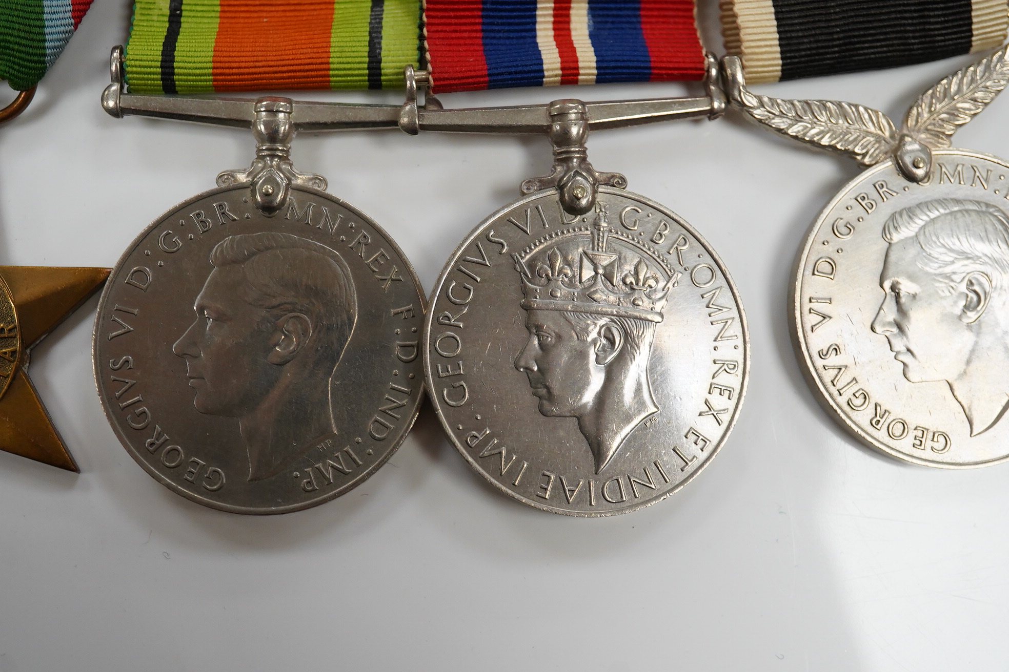 A New Zealand medal group, group of five medals including; The Service to New Zealand Medal 1939-1945, the Pacific star, the 1939 to 1945 star, etc. together with the cased miniature group. Condition - good